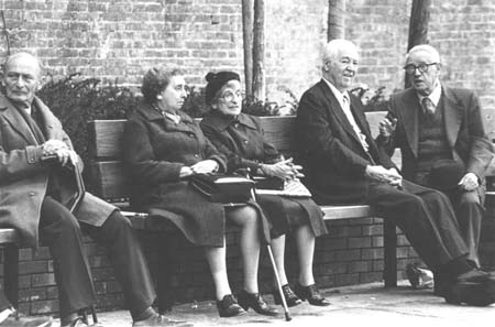Elderly on a park bench